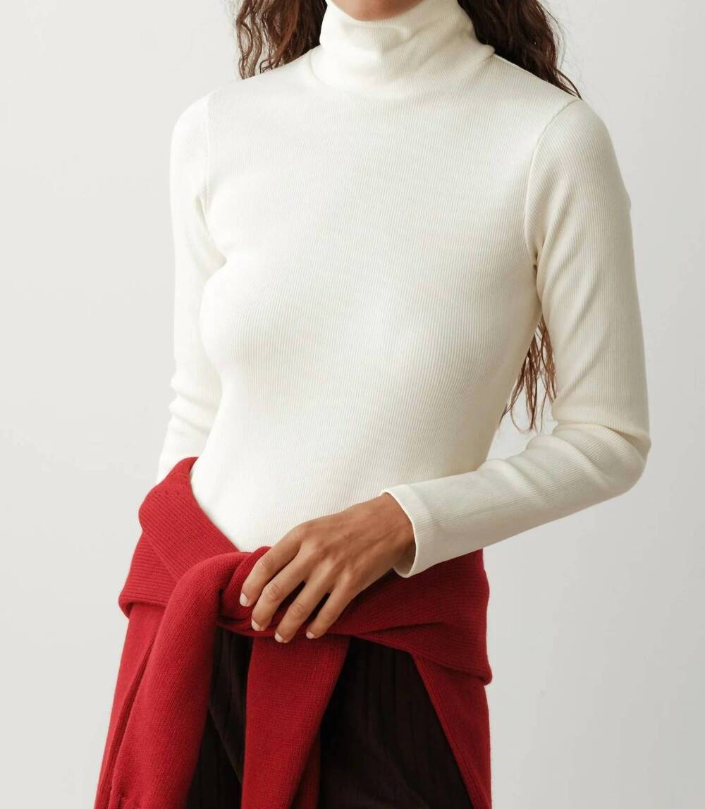 NEW DONNI. rib turtleneck top in creme